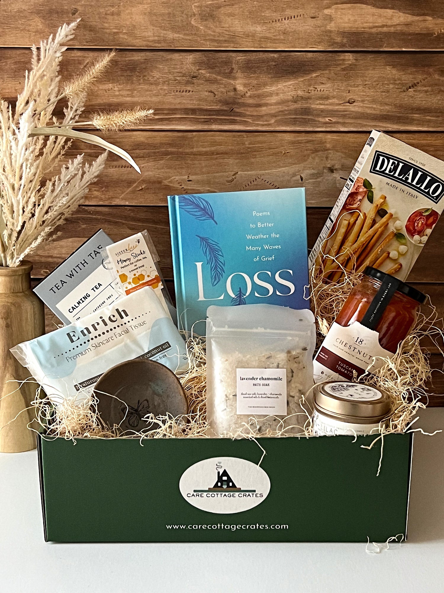 Sympathy Crate featuring a calming tea sachet, honey sticks, &