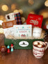 Holiday Crate featuring salted caramel cookies, a plaid knit scarf, hot chocolate mix, the &